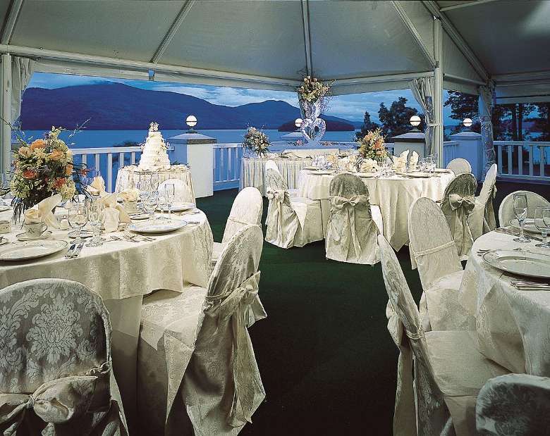an outdoor tent area for a wedding reception