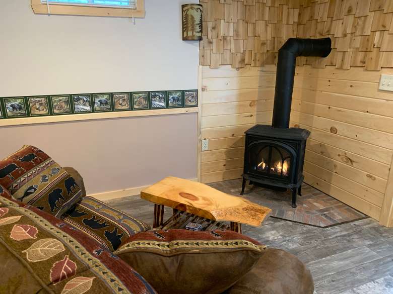 living area in cabin with fire