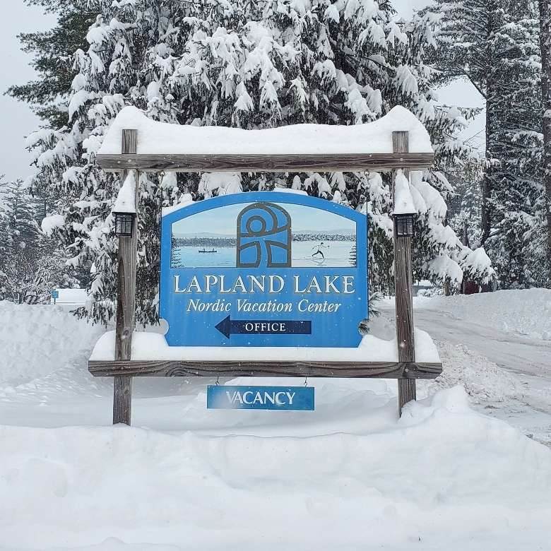 laplan lake sign with vacancy sign in winter