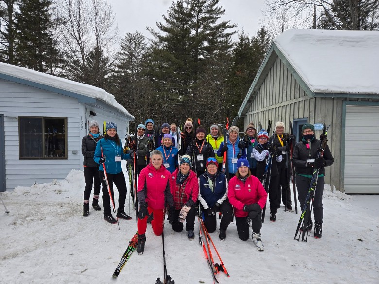 group of skiers pose together