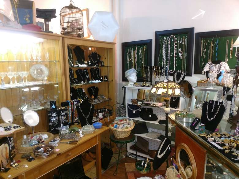 necklaces and other jewelry in display cases and on shelves