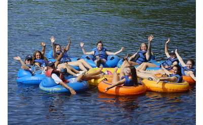 large group near each other on a lazy river trip