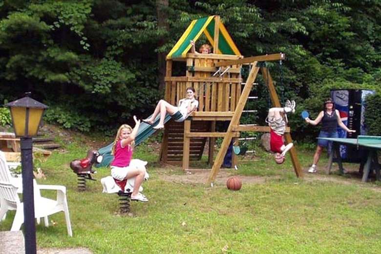 kids playing on a swing set