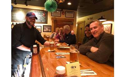 people seated at a bar