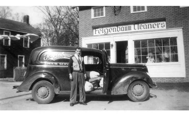 black and white photo of feigenbaum cleaners building and vehicle