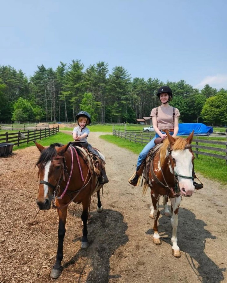two people horseback riding