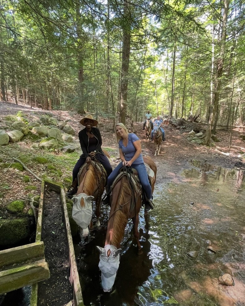 horseback riding in the woods