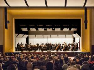 View from back of audience of the orchestra