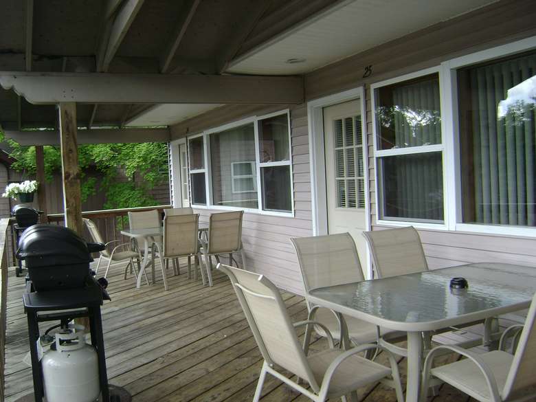 outside deck with tables and chairs set up