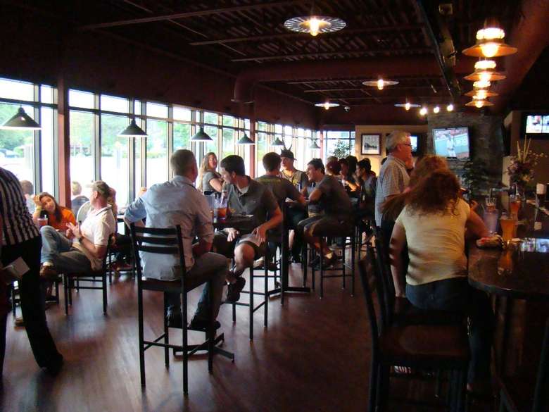 people sitting inside a restaurant dining area