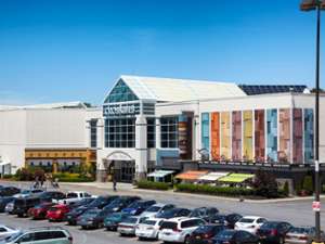 exterior of crossgates mall and the parking lot in front of it