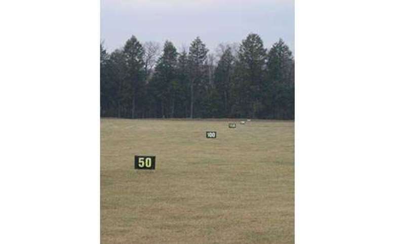yard markers at a golf driving range