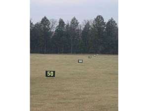 yard markers at a golf driving range