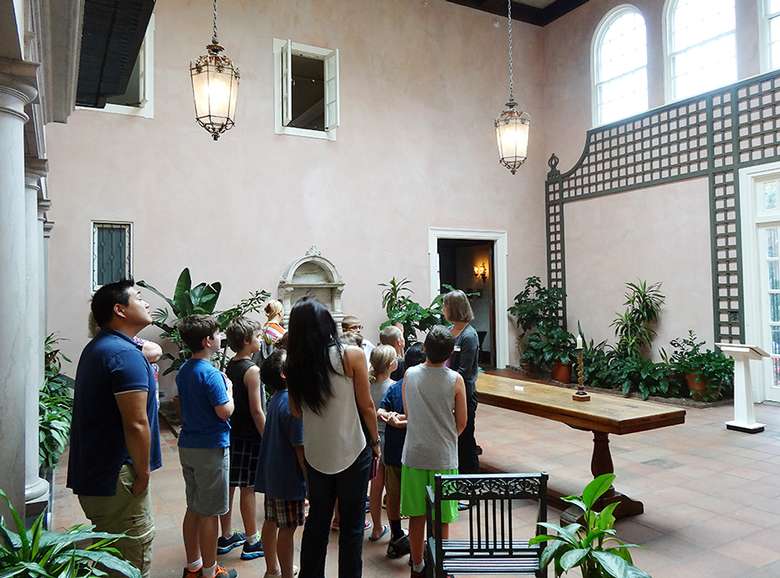 a tour group inside a room at The Hyde Collection