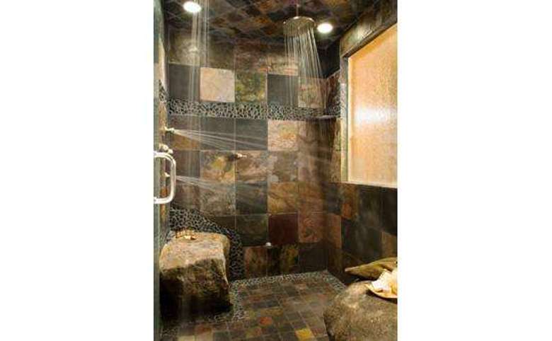 Guestroom "Forest" has an extra large shower with all sorts of body sprays and real boulder "seats" to sit on
