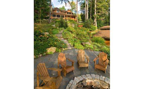 the lakefront fire pit  with Adirondack chairs around
