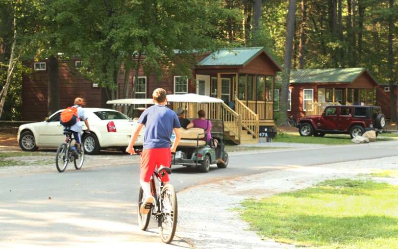 people riding on bikes in a campground