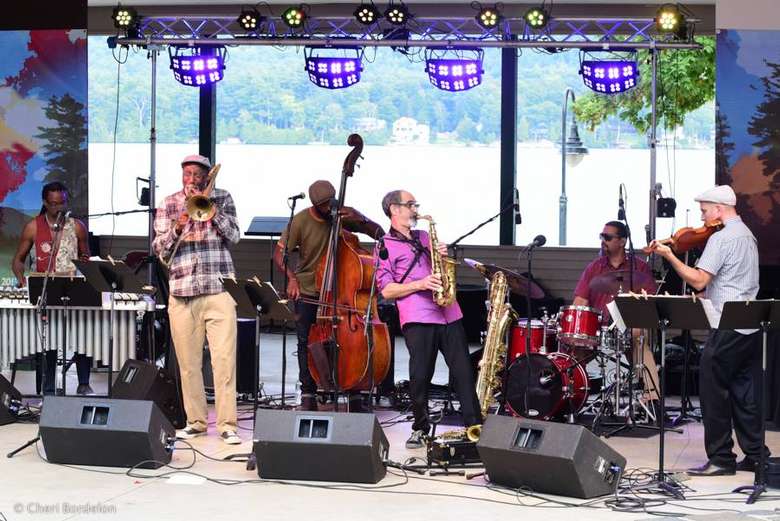 a jazz band performing on an outdoor stage