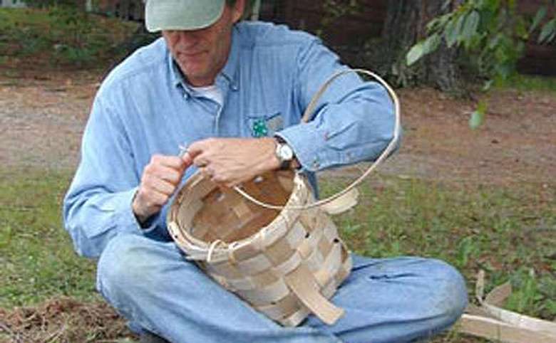 man working on a basket