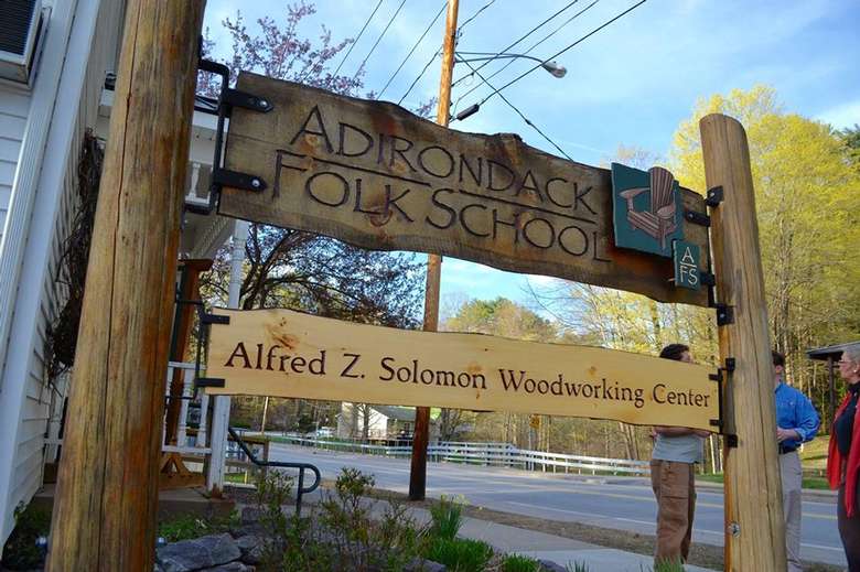 a sign outside the adirondack folk school