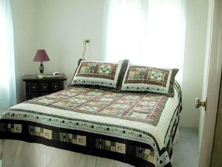 double bed with quilted bedspread