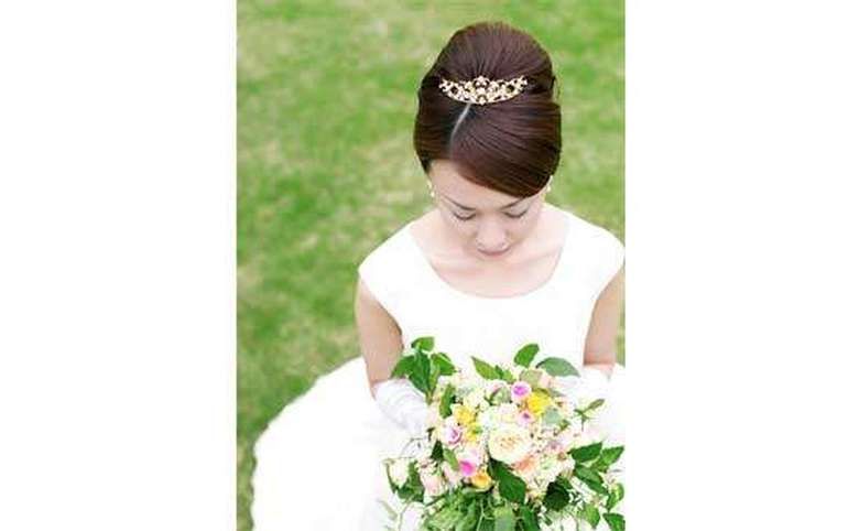 Photo from above of a bride's updo with a small tiara