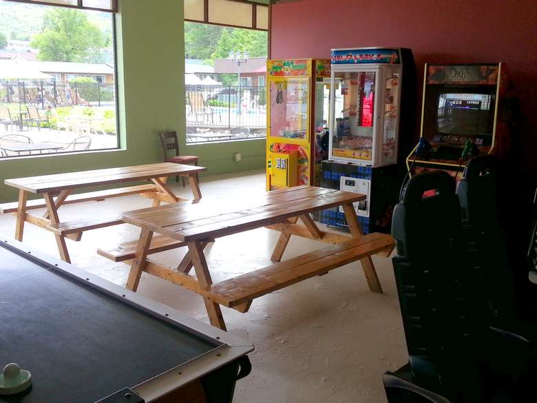 picnic tables inside of an arcade