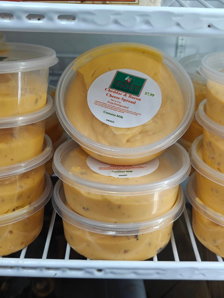 Containers of Locust Grove SmokeHouse Cheddar & Bacon Cheese Spread.