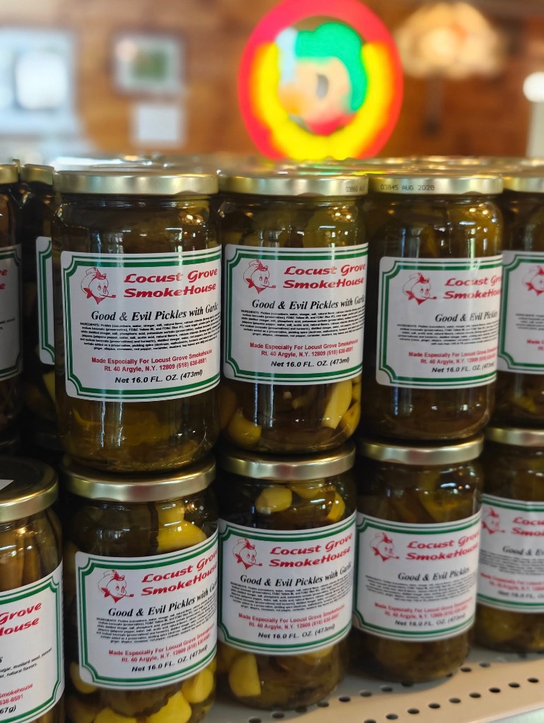 Stacked jars of Locust Grove SmokeHouse Good & Evil Pickles with Garlic.