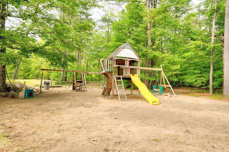 a wooden playground in the woods