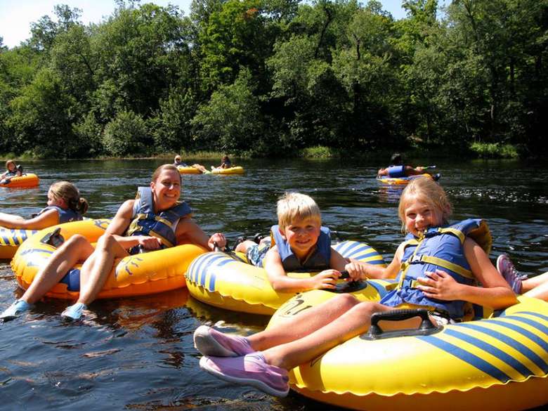group of people on river tubes