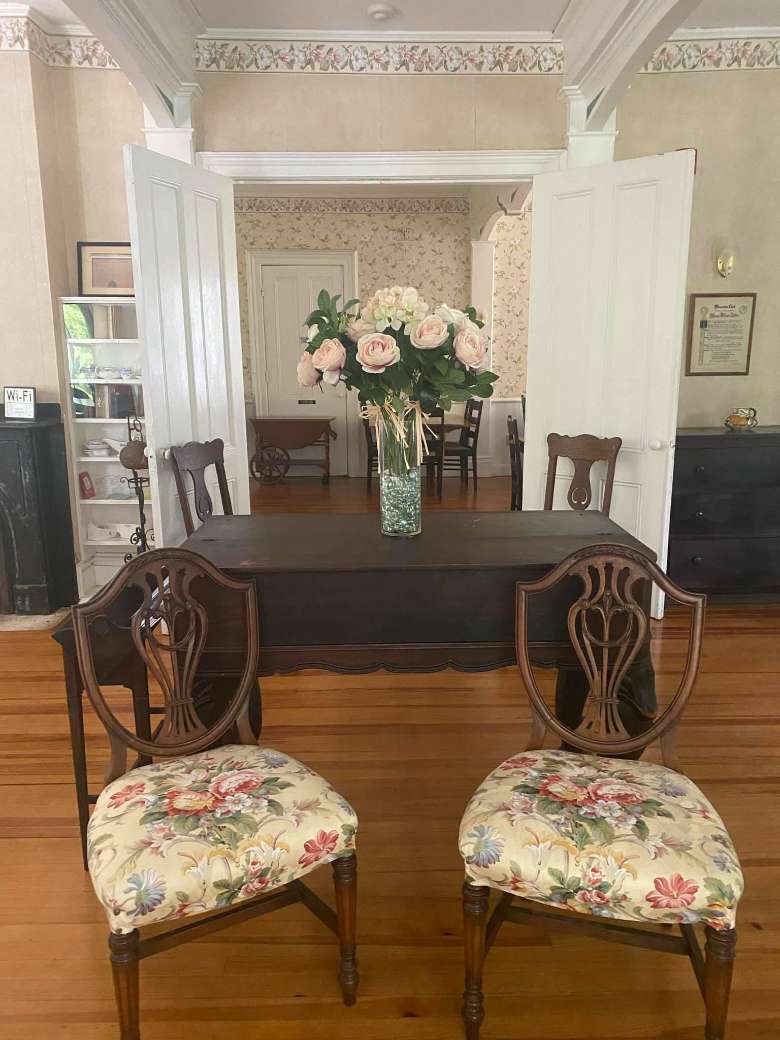 two chairs near a table in a house