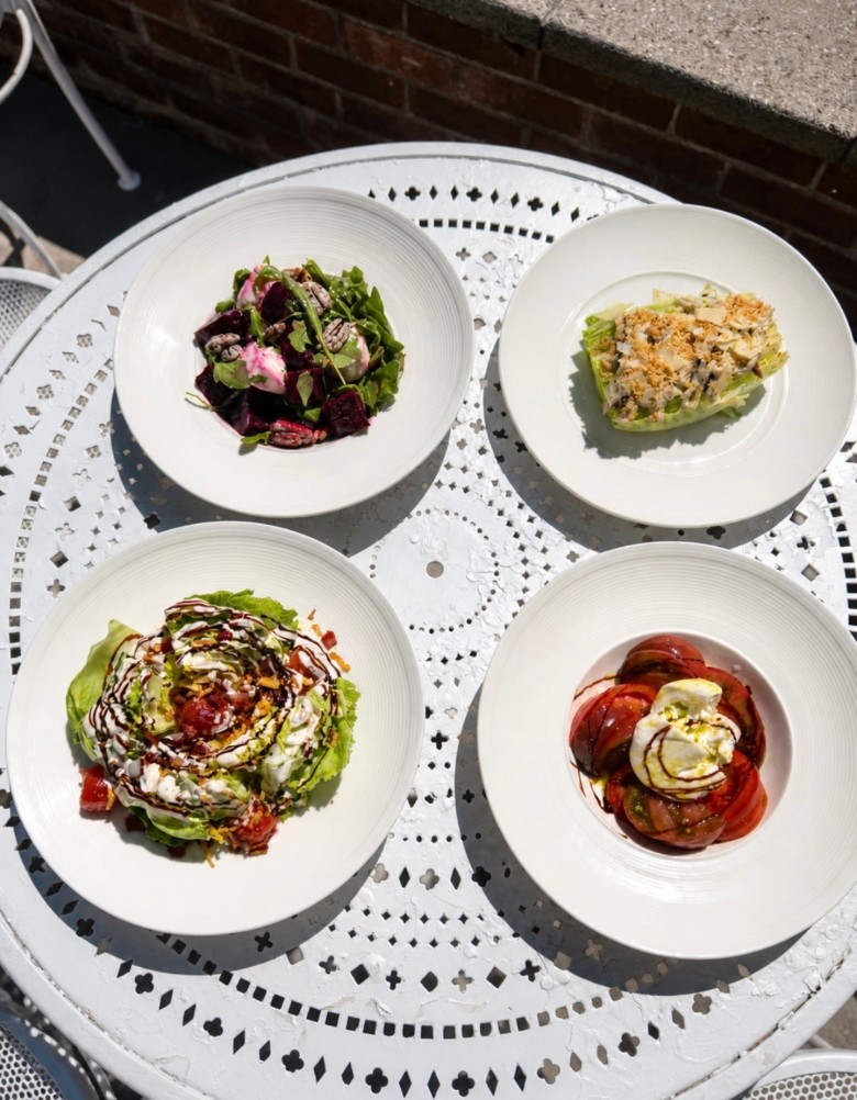 four plates of food on a large platter