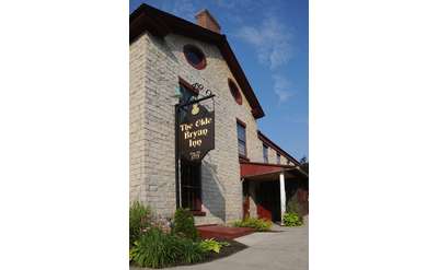 exterior of and sign for the olde bryan inn