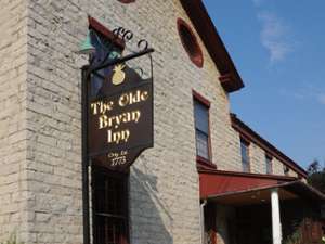exterior of and sign for the olde bryan inn
