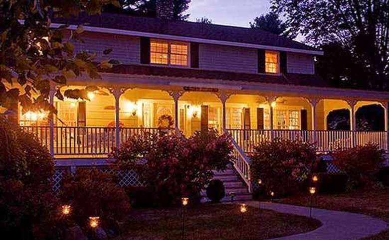 the bed and breakfast lit up at night