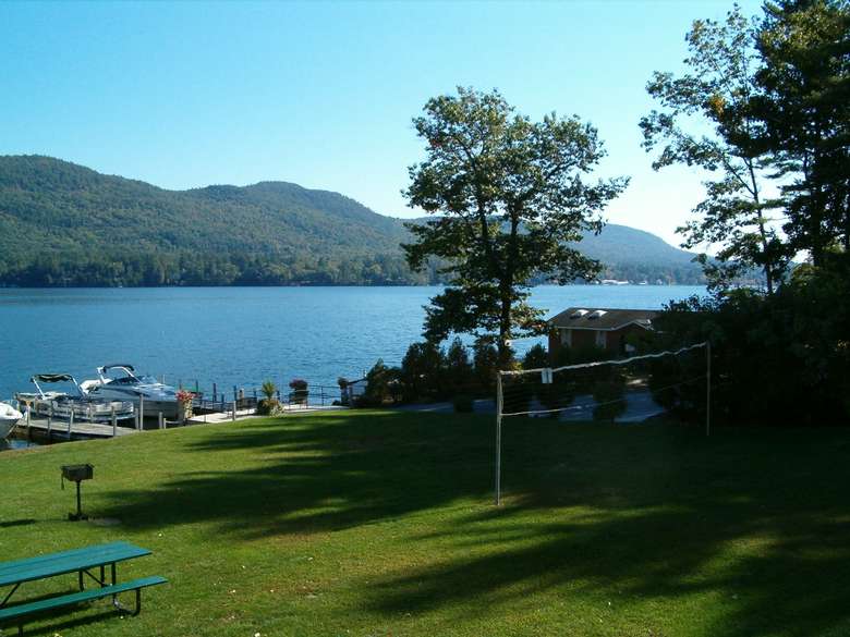 view of lake and lawn