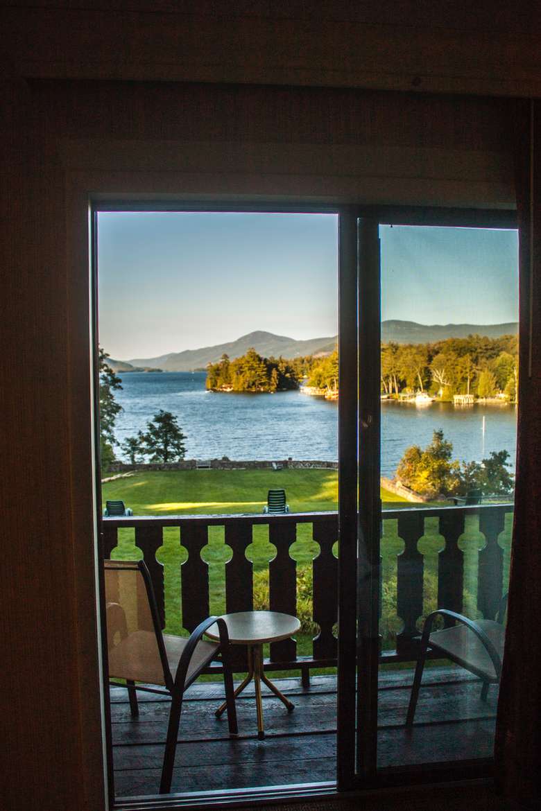 window showing beautiful mountain and lake view