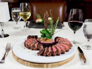 artfully plated steak with wine