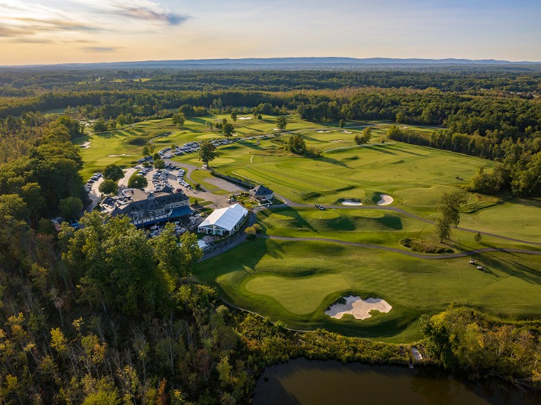 aerial view of a scenic golf course and clubhouse restaurant