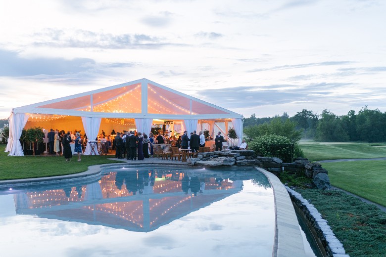 outdoor tent and seating by a pool
