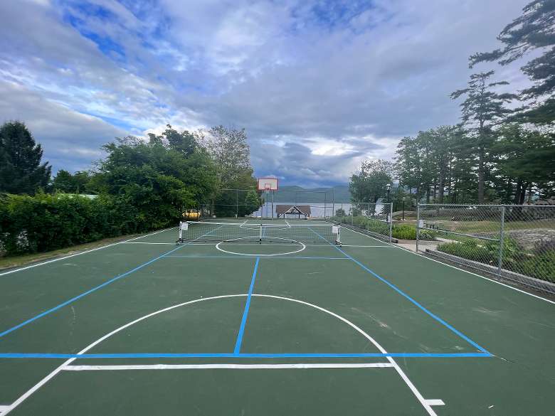 There is an additional pickleball court higher on the property in the basketball court area