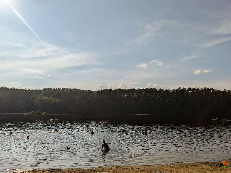 people swim in lake
