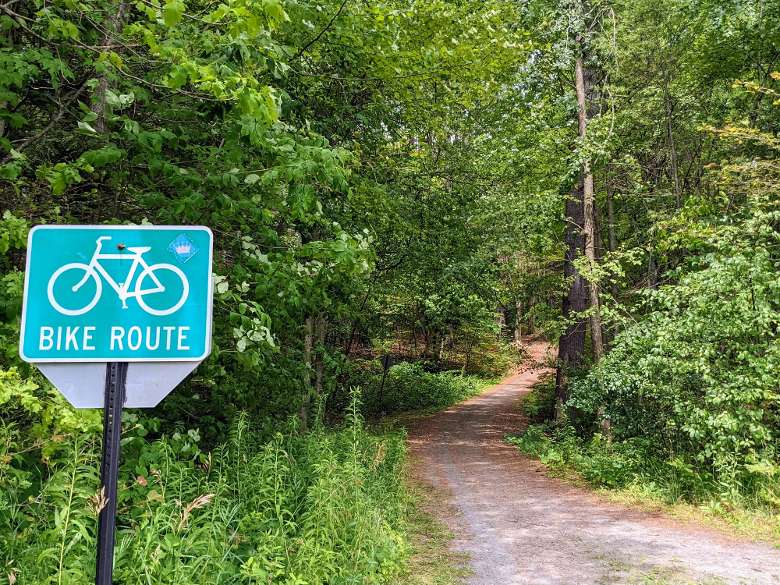 bike route sign by path