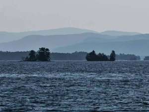 two islands on a lake in the far off distance