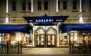 the front entrance of the adelphi hotel at night