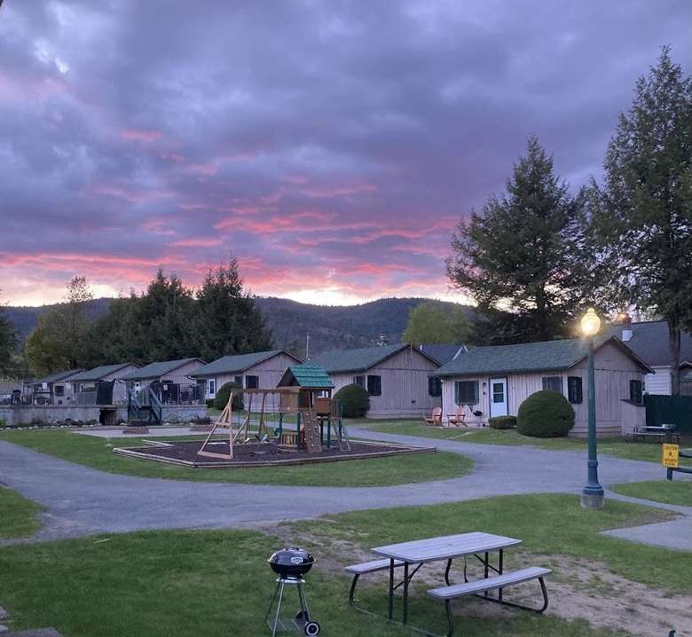 sunset by cabins and playground