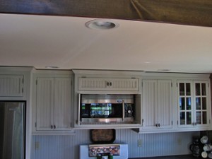 a microwave set within a row of upper cabinets