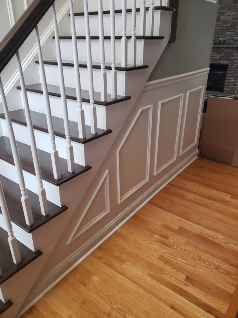 Refinishing of stairs that were carpeted with wainscot trim