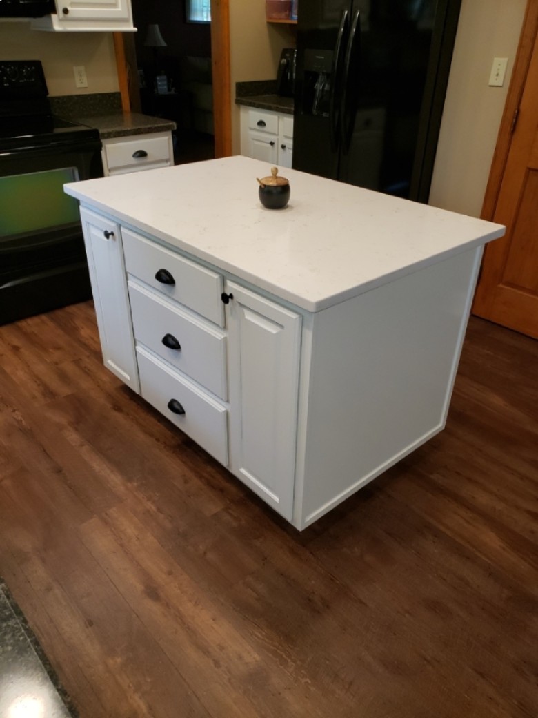 Custom made island in maple with white lacquer finish